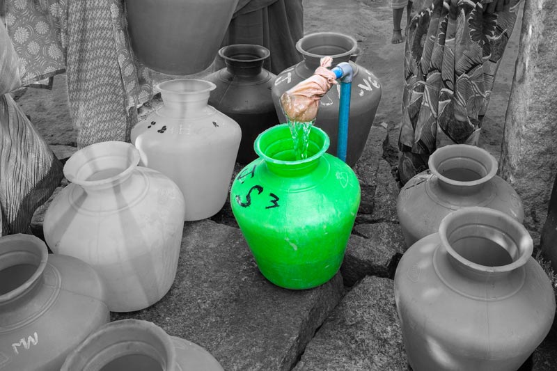Impediments to enjoyment of Human Right to Water: 'Quality' Norm - Procuring fluoride-contaminated and saline drinking water at a public standpoint supplied by the tubewell shown earlier in Kolar district, Karnataka